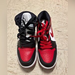 Red, white and black Nike shoes